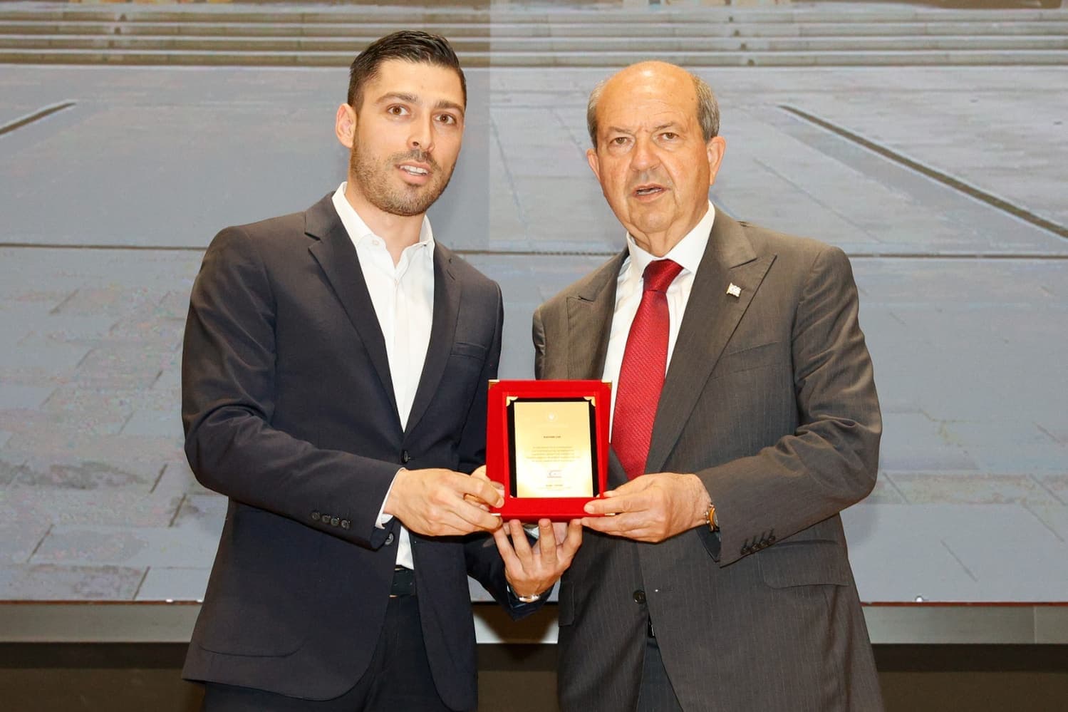 A Kamtek Ltd. representative and the President of the TRNC with a commendation plaque.